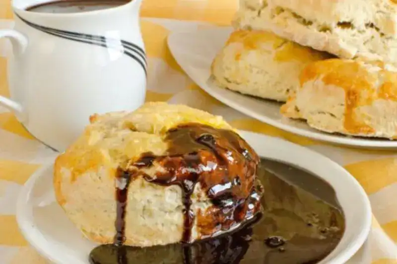 Biscuits topped with chocolate gravy, featured in a guide to Pigeon Forge breakfast spots.


