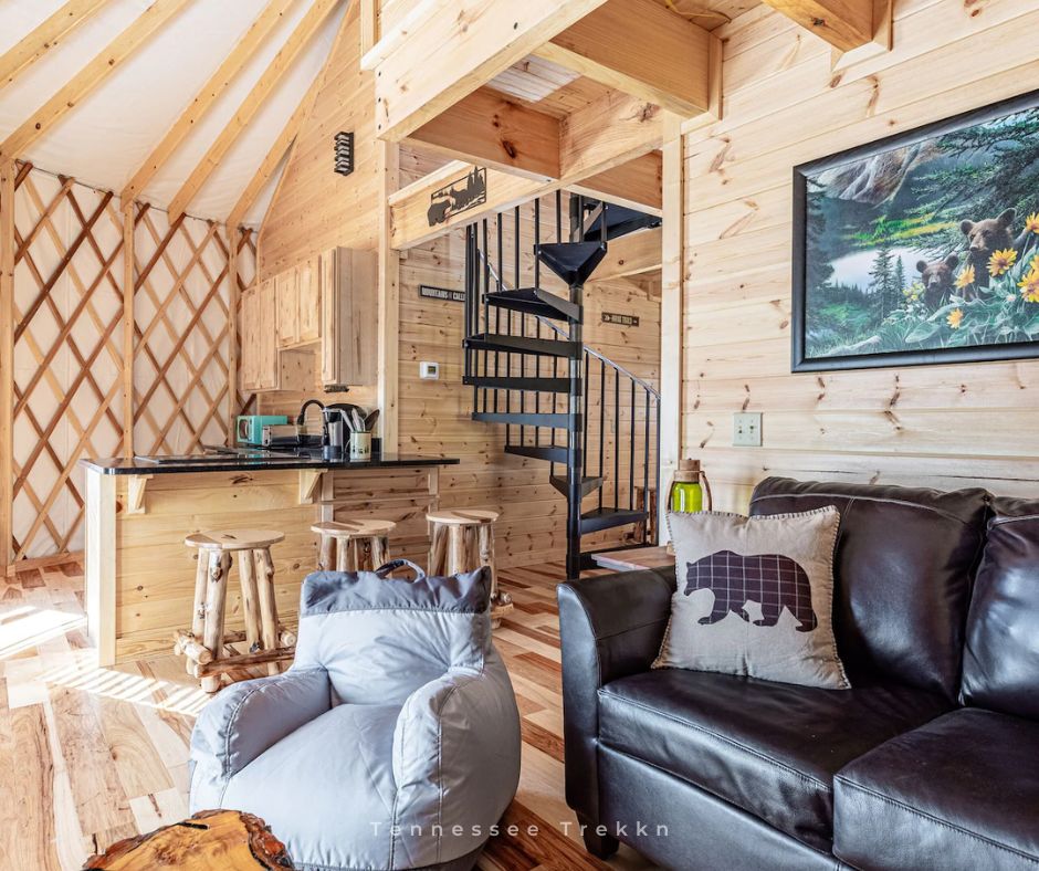 Bearby House Yurt: The open living area, kitchen, and spiral staircase make this yurt feel like a cozy cabin!