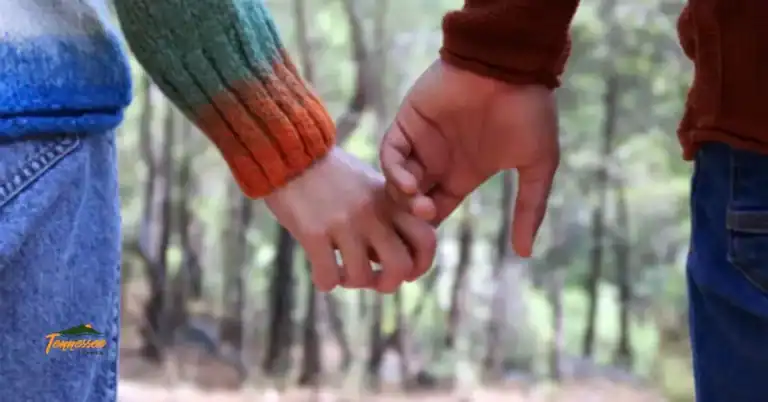 Couple holding hands in the mountains, representing romantic getaways and things to do for couples in Gatlinburg TN.