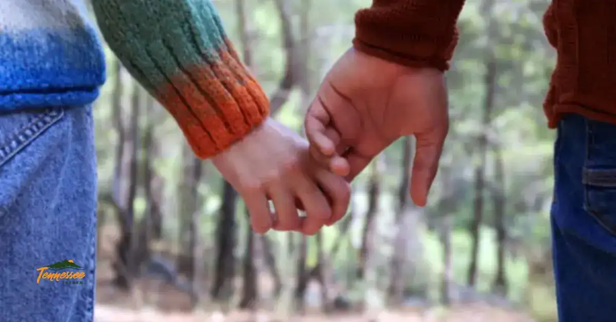 Couple holding hands in the mountains, representing romantic getaways and things to do for couples in Gatlinburg TN.