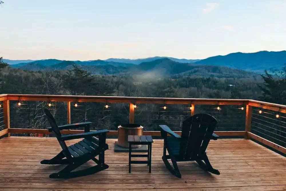 Smoky Mountain views from deck of a glamping tent offerning modern accomodations.