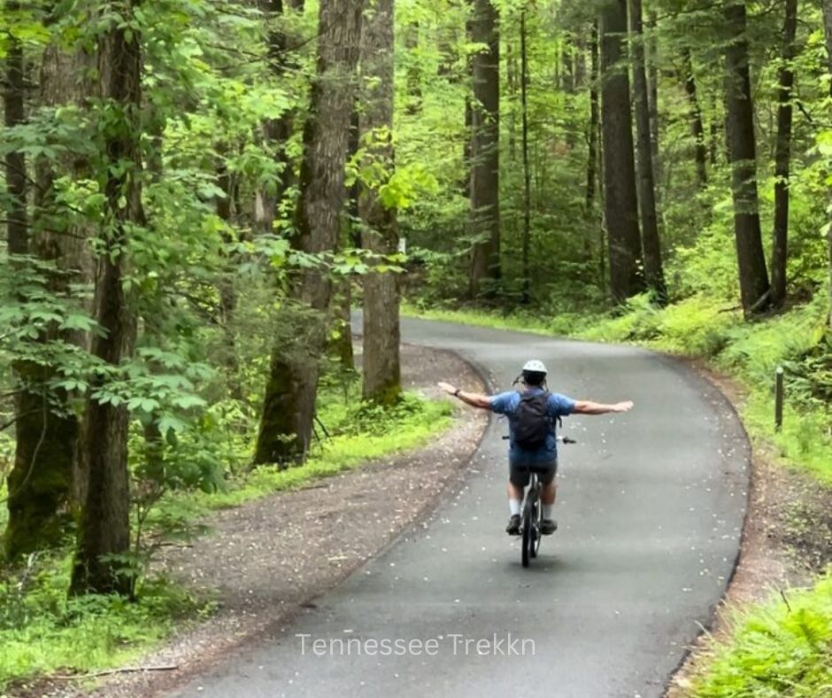 My hubby biking through Cades Cove—family fun at its best!