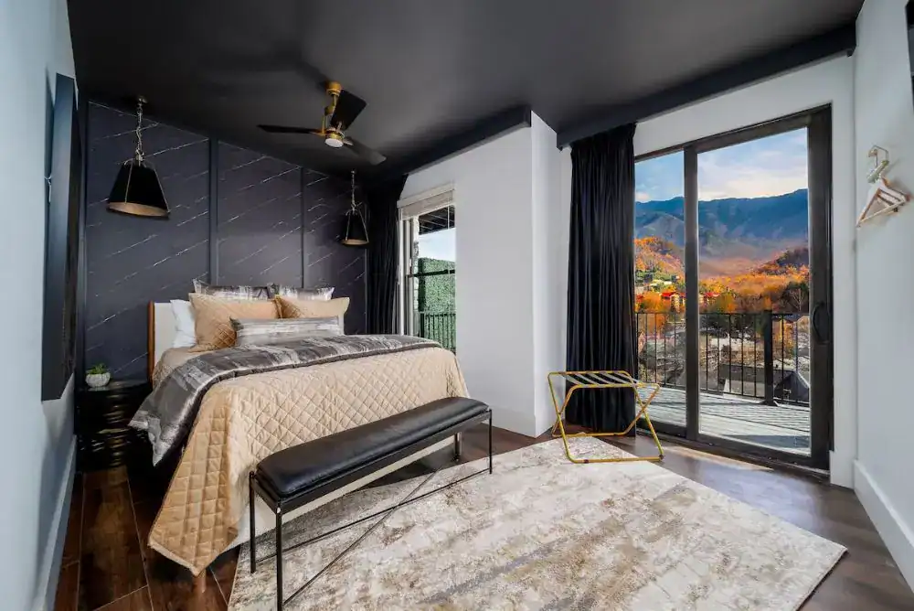 Queen bedroom in a large group Gatlinburg cabin with mountain and downtown views
