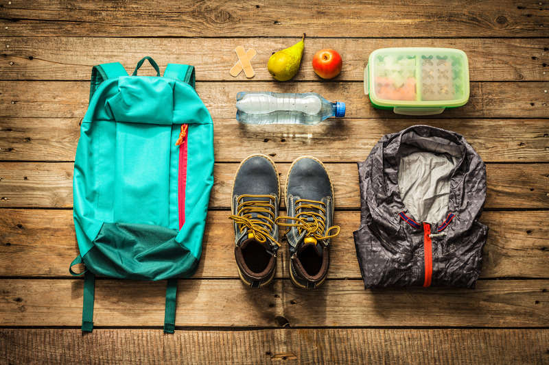 hiking with kids; backpack essentials; shoes, snacks, water, rain jacket, first aid