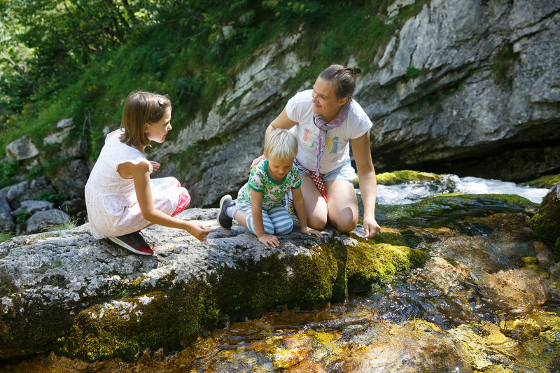 Mom with son and daughter, at creek in the Smoky Mountains, Cades Cove Camping Fun!