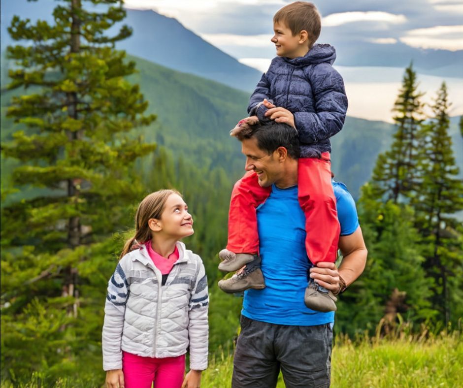 dad and kids hiking in the mountains