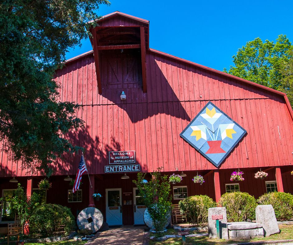 Entrance to Museum of Appalachia.  Red Building with flag.  Tennessee History