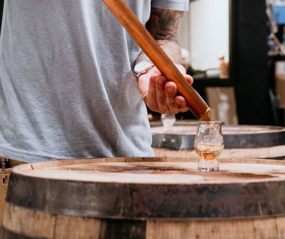 Whiskey being poured straight from the barrel.  