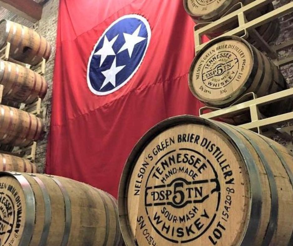 made in Tennessee Whiskey Barrels, with Tennessee Flag, red flag with blue circle in the middle with 3 white stars. 