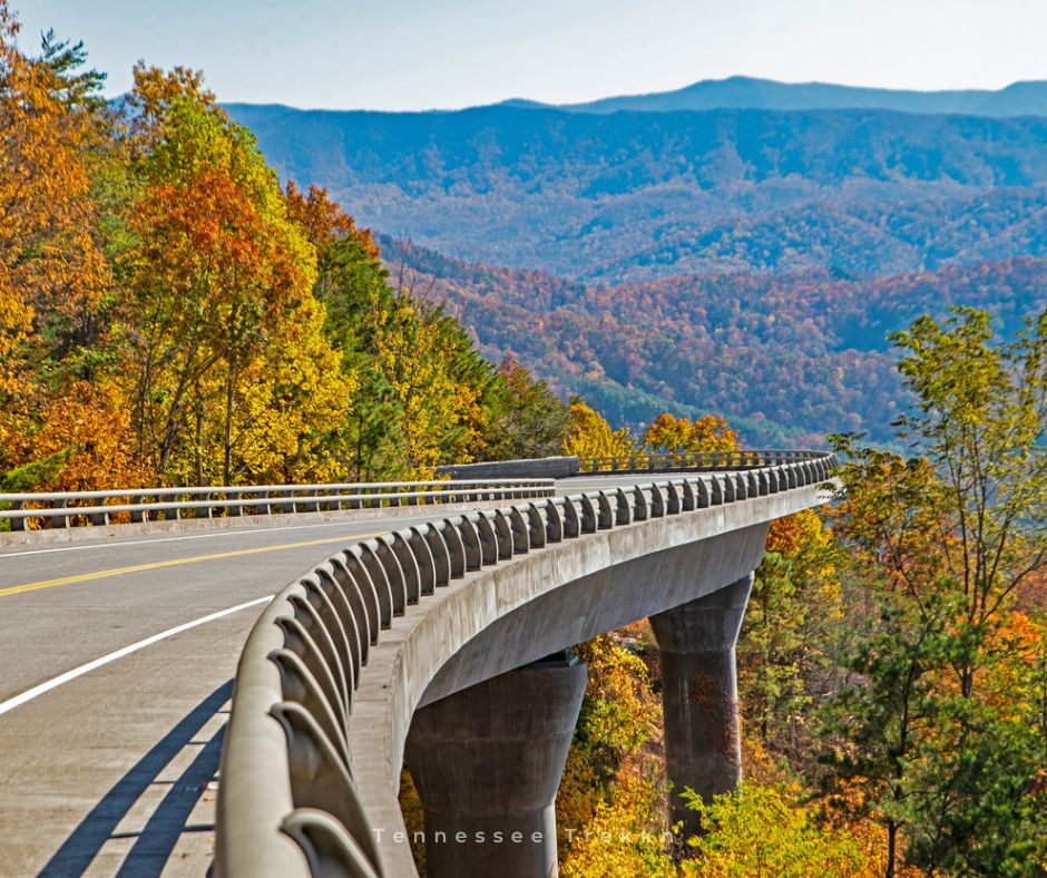 A scenic view of the Foothills Parkway, showcasing winding roads and breathtaking Smoky Mountain landscapes, perfect for your 2025 Tennessee bucket list.