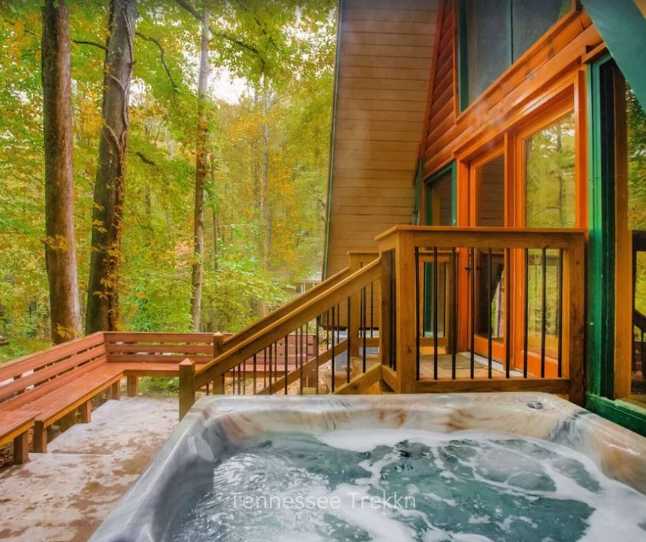 Outdoor hot tub at Bear Country Lodge with stunning mountain views.