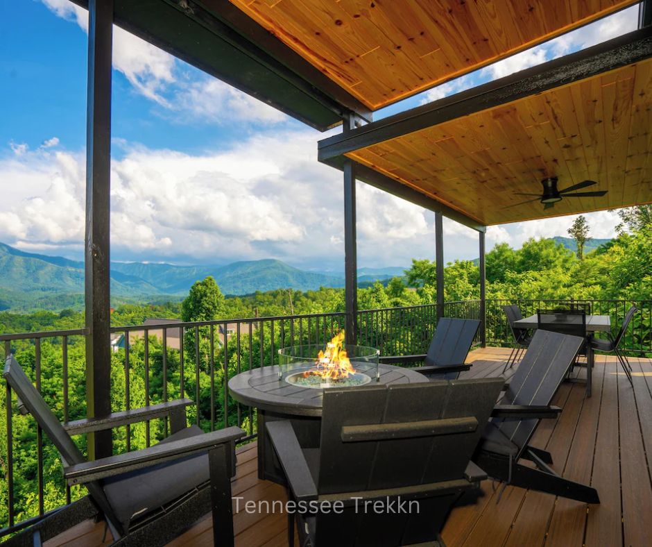 Outdoor deck with fire pit, comfortable seating, and scenic mountain views at Stayin On The Mountain cabin.