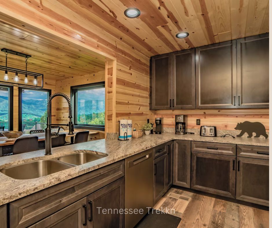 Gourmet kitchen with mountain views, modern appliances, and spacious design at Stayin On The Mountain cabin.