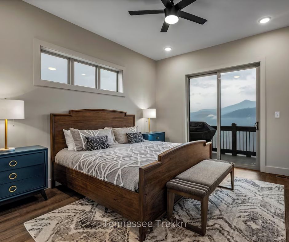 Bedroom at WatchTower with balcony access and views of Smoky Mountains.