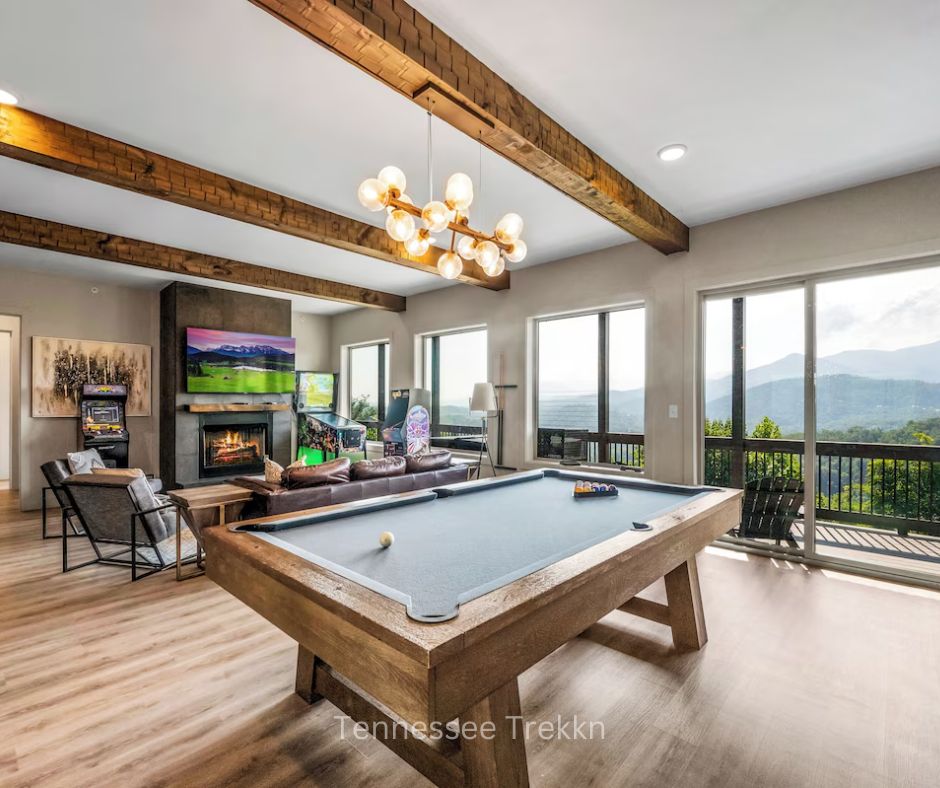 Game room at WatchTower with doors to deck and scenic mountain views.