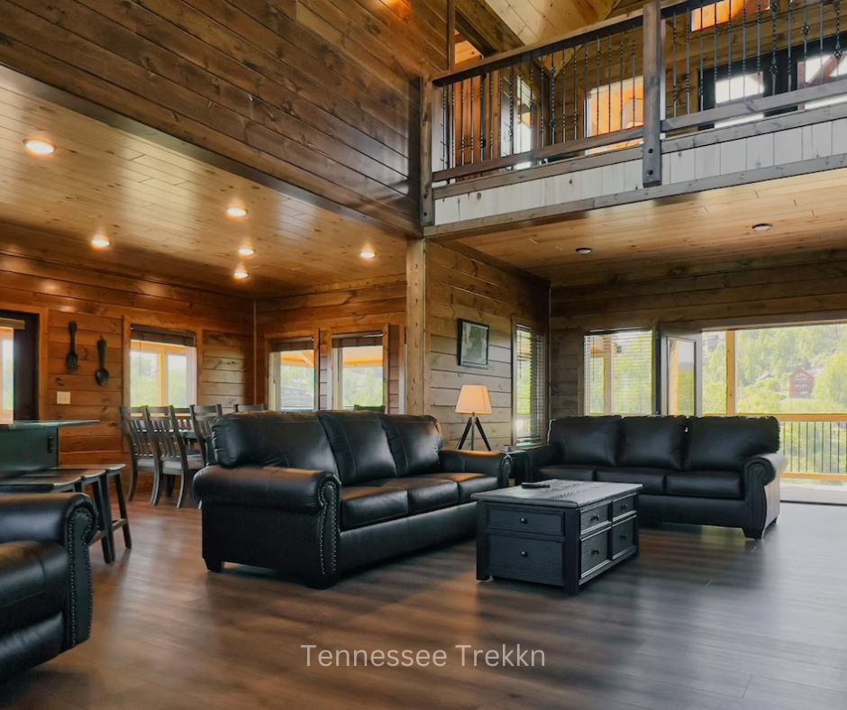 Open living and dining area at Mountain Oasis cabin with large windows and mountain views.