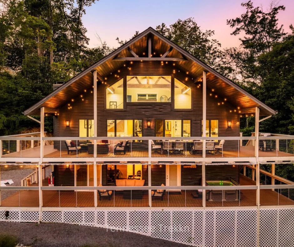 Garrett Lodge cabin lit up at dusk, creating a warm, inviting glow.