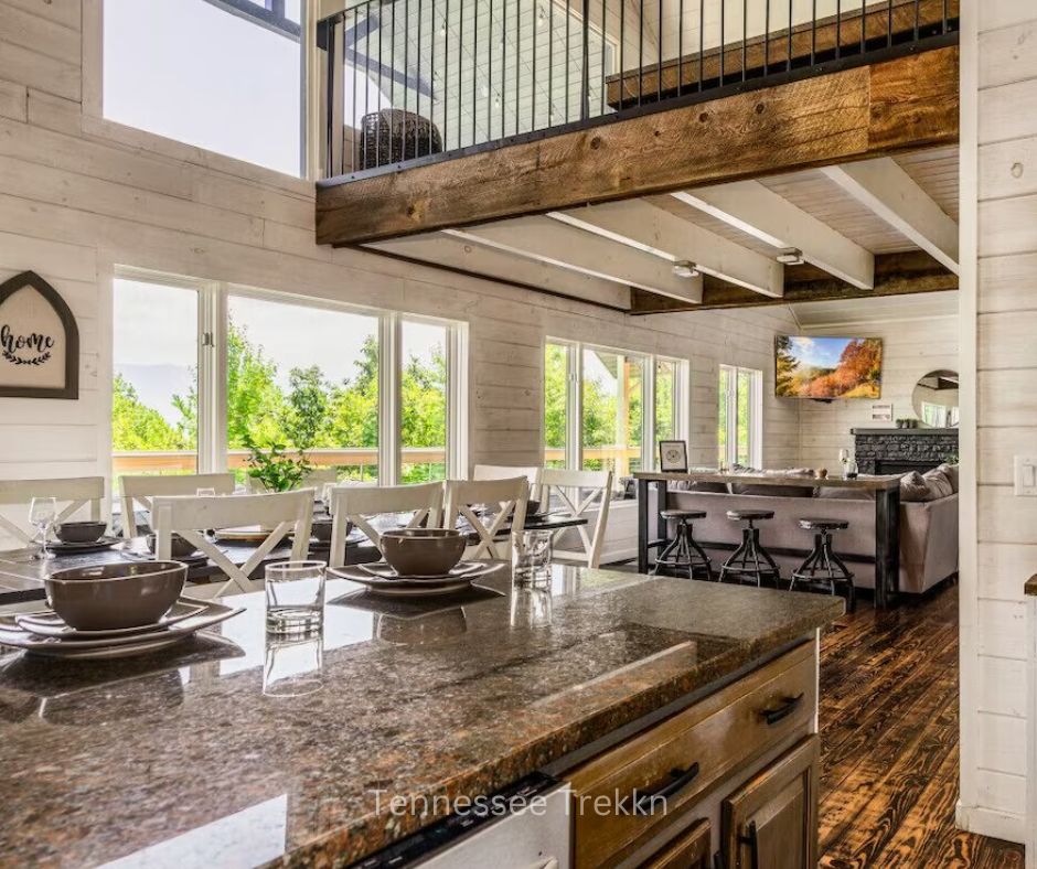 Spacious open living area with large windows and mountain views at Garrett Lodge.