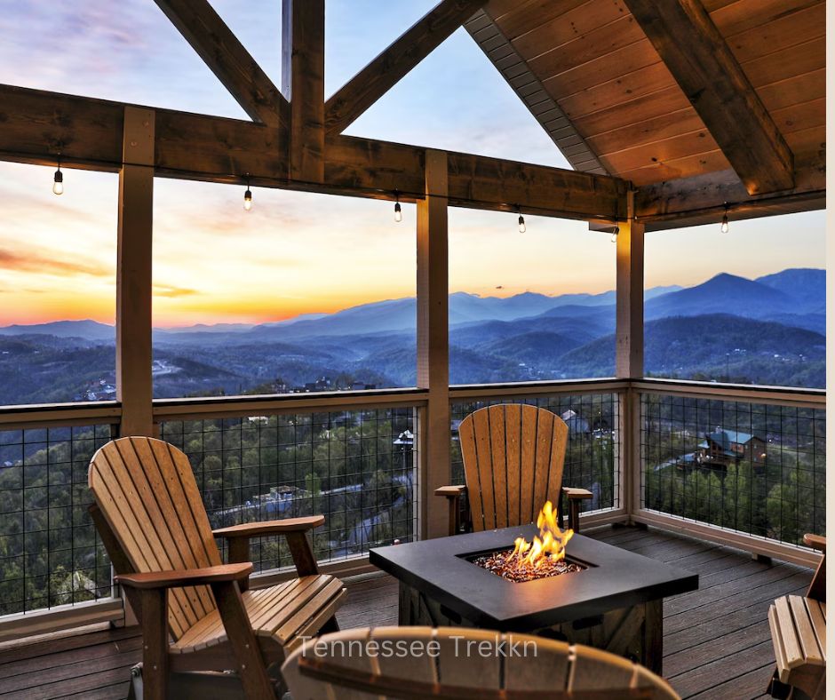 Outdoor seating area with fire pit and mountain views at sunset at Heaven’s Perch. Chalet Village Gatlinburg Cabin