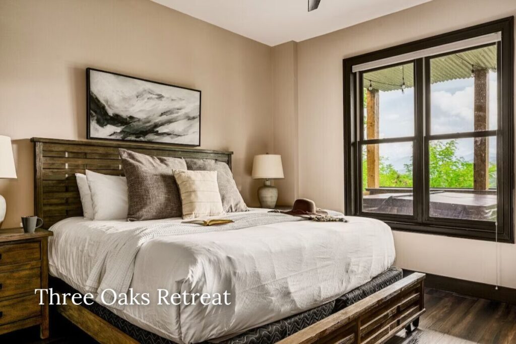 Luxury cabin bedroom at Three Oaks Retreat in Chalet Village Gatlinburg featuring upscale design and cozy comfort.
