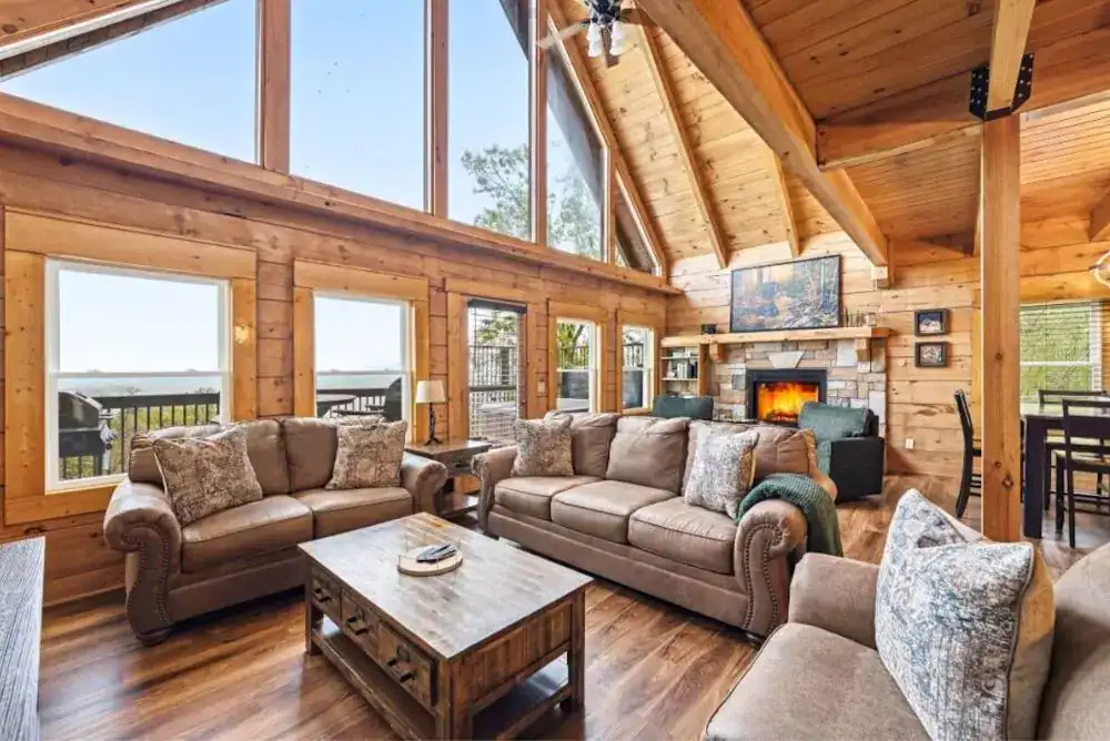 Great room at Ober Overlook in Chalet Village with vaulted ceilings, stone fireplace, and mountain views.
