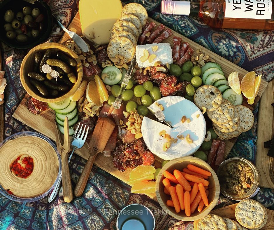 A stunning charcuterie spread featuring meats, cheeses, and fruits, displayed on a handcrafted charcuterie board by Mark’s Beautiful Creations.