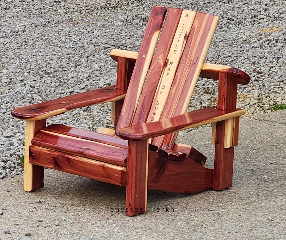 A handcrafted Adirondack chair by Mark’s Beautiful Creations, perfect for relaxing outdoors in style and comfort.