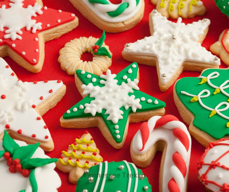 Colorful Christmas sugar cookies decorated with icing, including Santa and star shapes, made using a delicious sugar cookie recipe.