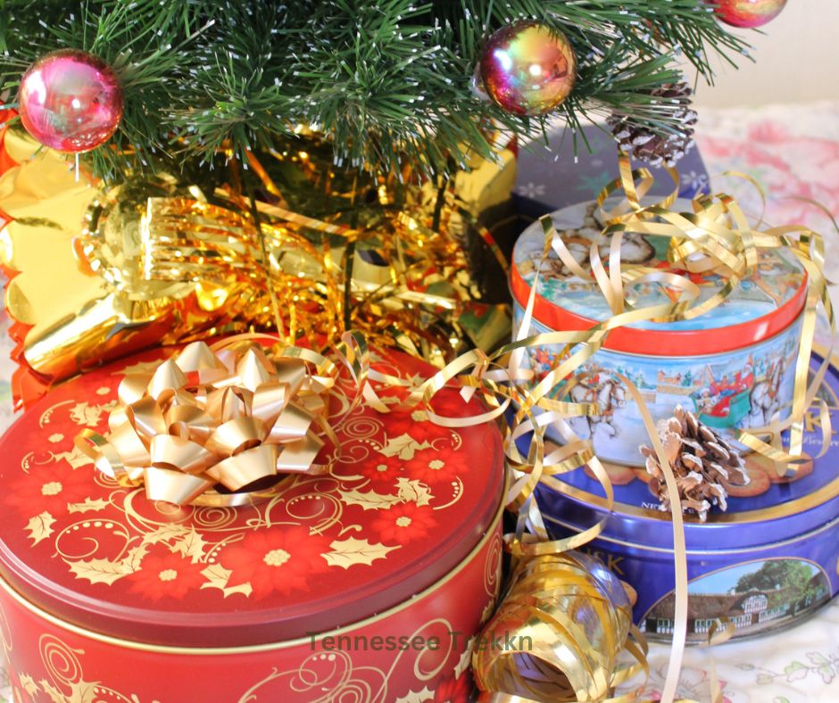 Festive tins filled with Christmas sugar cookies, perfect for gifting and sharing during the holiday season.