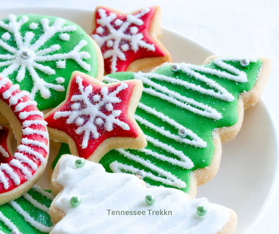 Christmas sugar cookies shaped like trees and snowflakes, decorated with colorful icing and sprinkles for a festive holiday treat.