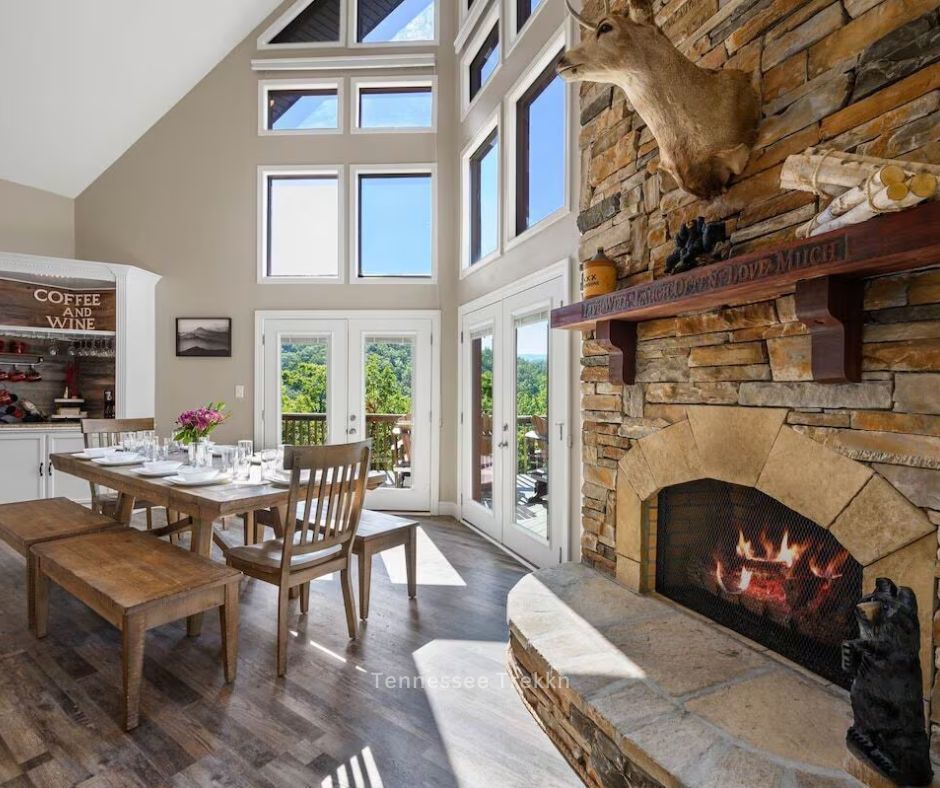  A cozy dining area in a Christmas cabin in the Smokies, featuring a rustic wooden table and seating for eight.