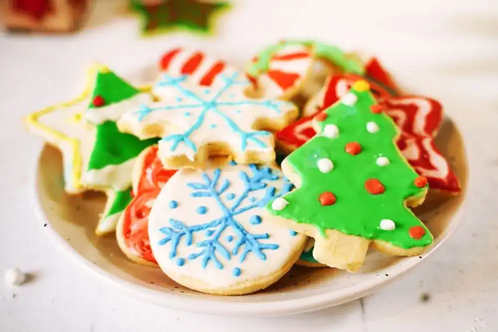 Plate of decorated Christmas sugar cookies from a fun holiday baking day.