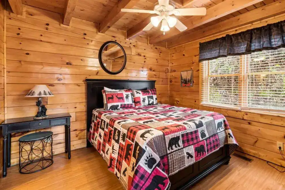 Cozy bedroom inside a Smoky Mountain cabin, perfect for a relaxing mountain getaway