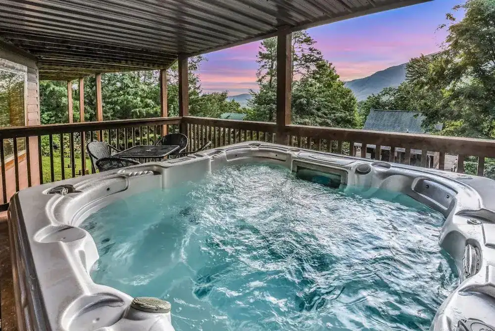 Outdoor hot tub at a Smoky Mountain cabin, ready for a winter soak