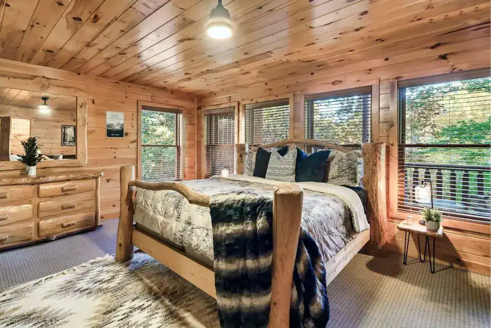Cozy bedroom inside a ountain rental, perfect for a relaxing weekend trip