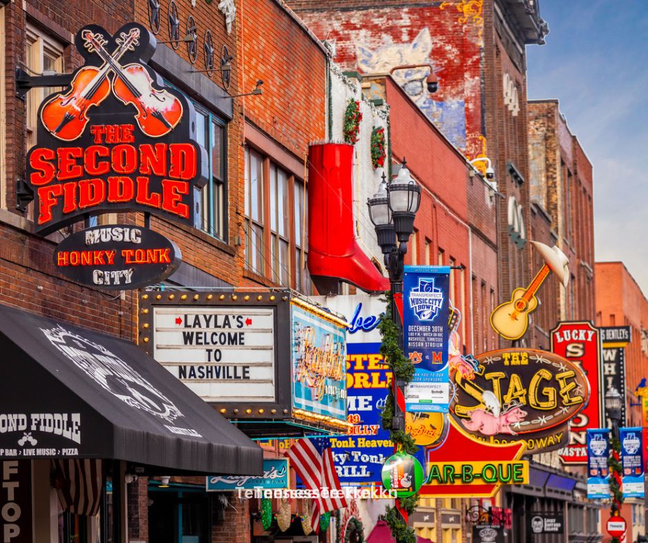 Bustling downtown street in Nashville, Tennessee, featuring vibrant shops and historic architecture.