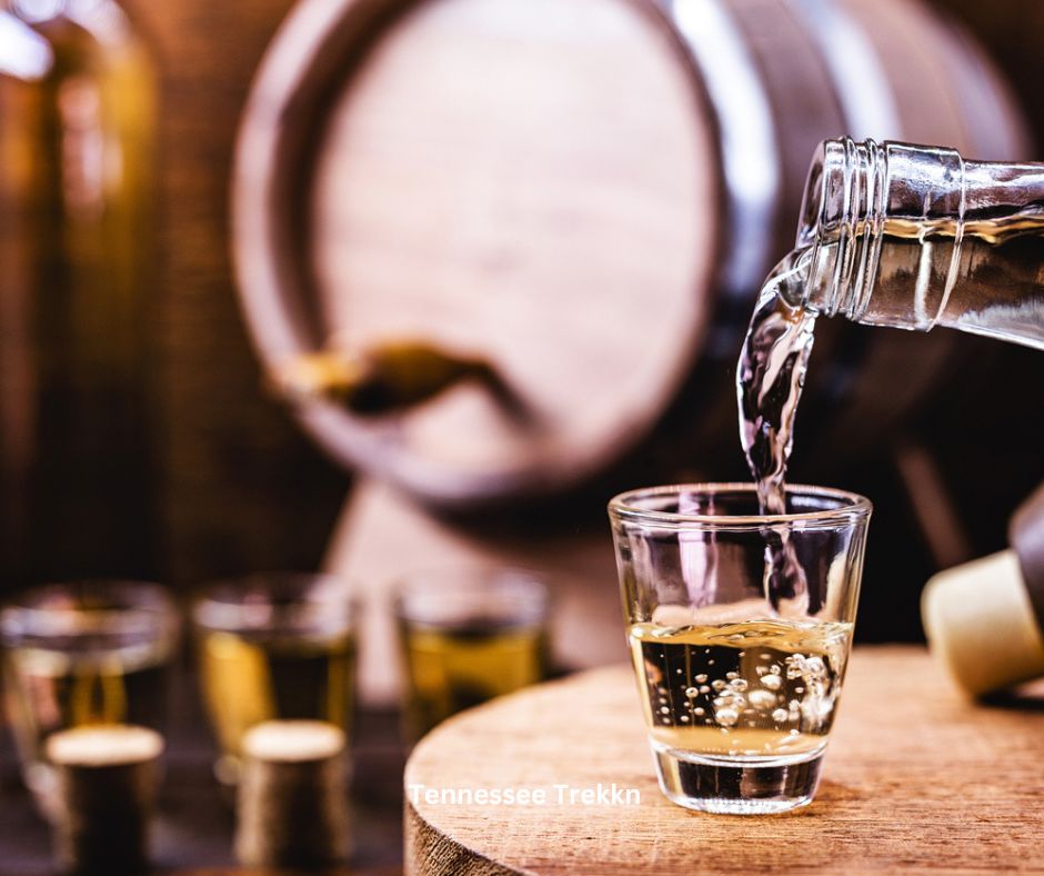 Moonshine being poured into a tasting glass, showcasing a classic Tennessee experience. Great for 2025 Tennessee Bucket List!