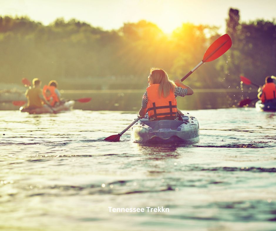 A person kayaking on the serene waters of Norris Lake.