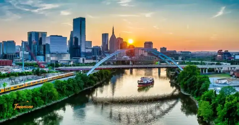 Downtown Nashville riverfront at sunset, representing the Tennessee bucket list of music, culture, and scenic experiences.