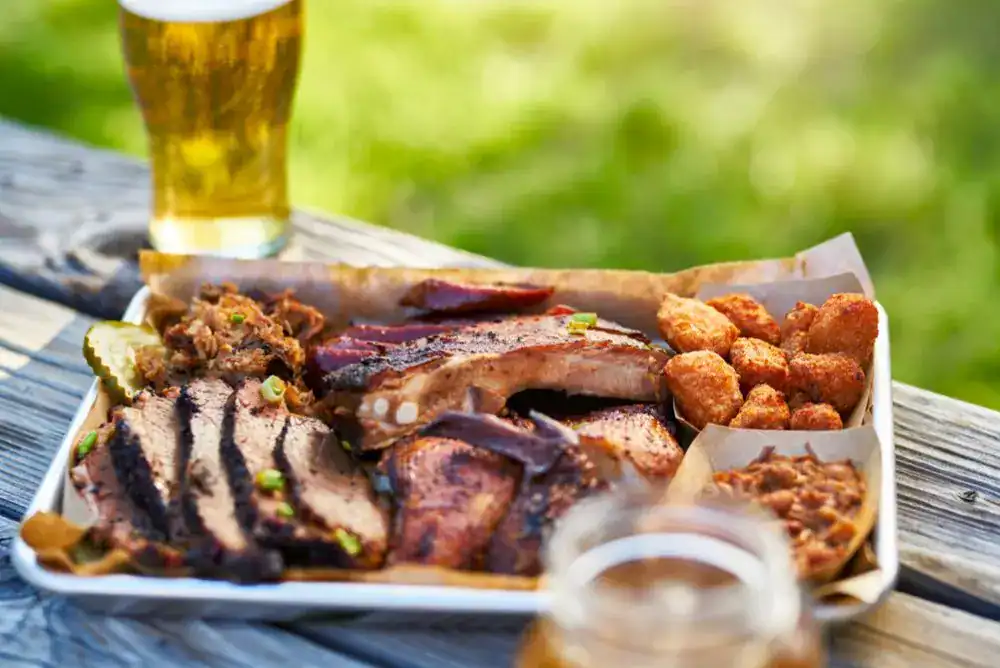 Tennessee barbecue plate with smoked meat and sides, a must-try Tennessee experience and delicious add on your bucket list