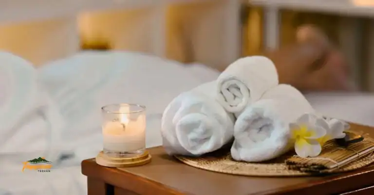 Candles and rolled towels at Wake Foot Spa in downtown Knoxville TN, highlighting the peaceful and rejuvenating spa atmosphere.