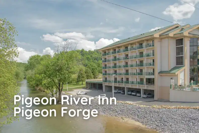 Pigeon River Inn exterior with riverfront views — one of the quieter Pigeon Forge hotels under $100.