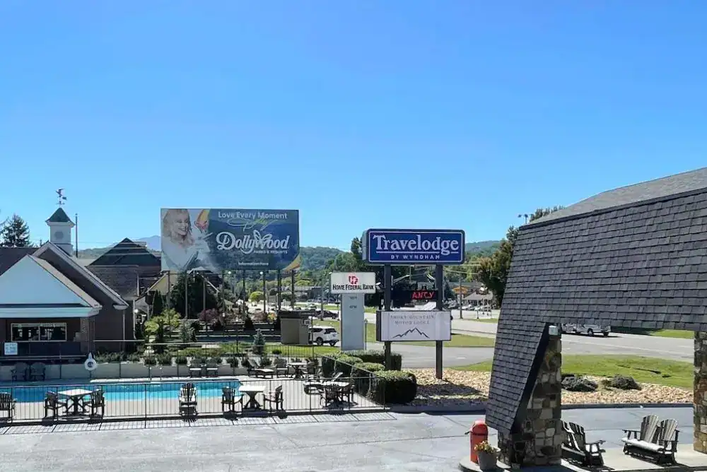 Outdoor pool and hotel grounds at Travelodge by Wyndham Pigeon Forge Dollywood Lane, located near Dollywood.