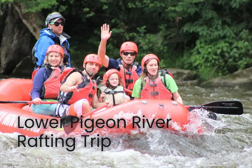 Family laughing together while paddling down a gentle river in a large inflatable raft