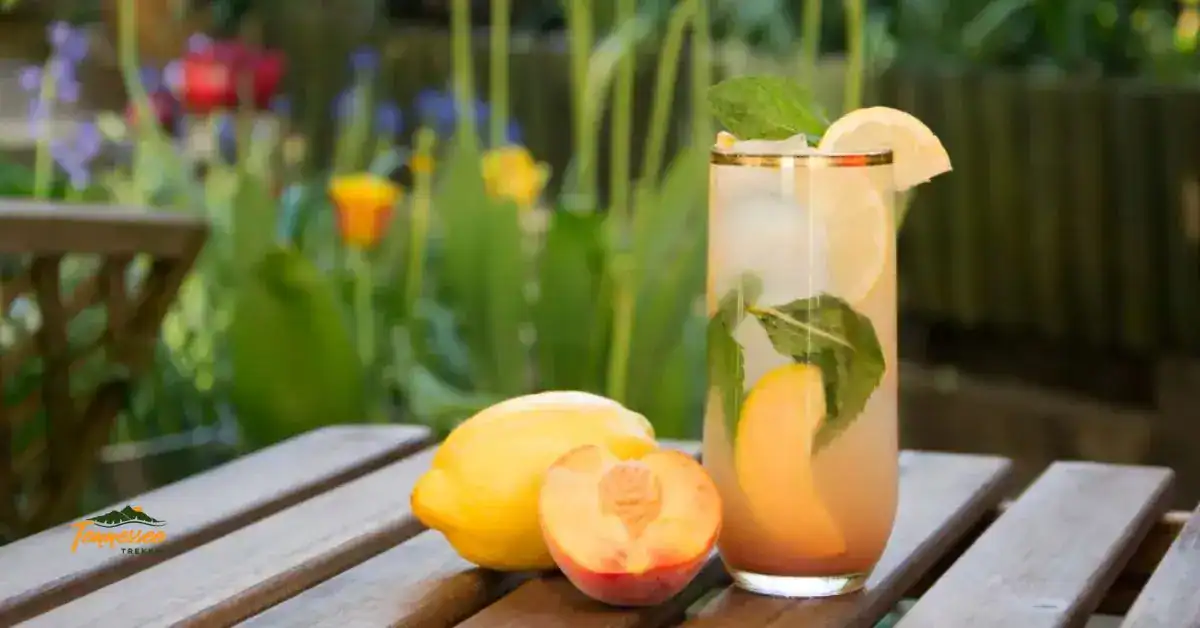 Bless Your Peach – peach moonshine cocktail served over ice in a clear glass, Tennessee-inspired drink