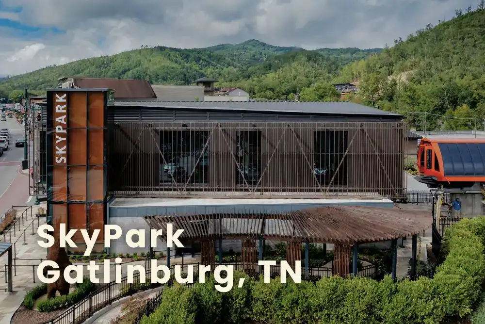 Gatlinburg SkyPark ticket booth with SkyLift sign and scenic Smoky Mountain backdrop