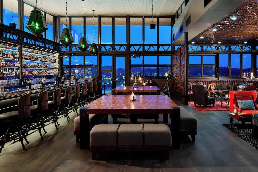 Rooftop bar view at Whiskey Thief with river and city skyline

