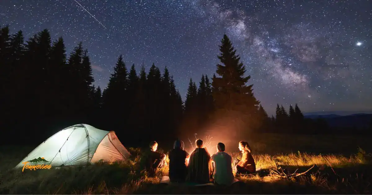 Family camping with a campfire at a Tennessee campsite, showing safe and fun camping outdoors.