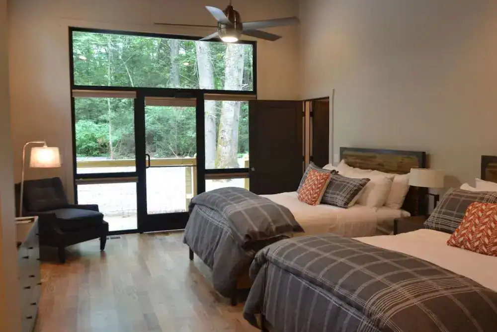 Double room at Dancing Bear Lodge in Townsend, TN with views of the woods.

