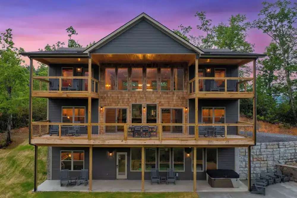 Smoky Mountain rental exterior surrounded by trees—this home includes a private pool.